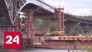 Глава Московской области дал старт стыковке пролетных сооружений моста через Волгу в Дубне - Росси…
