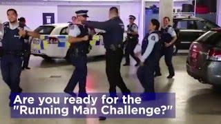Police officers across the globe dance the "Running Man"